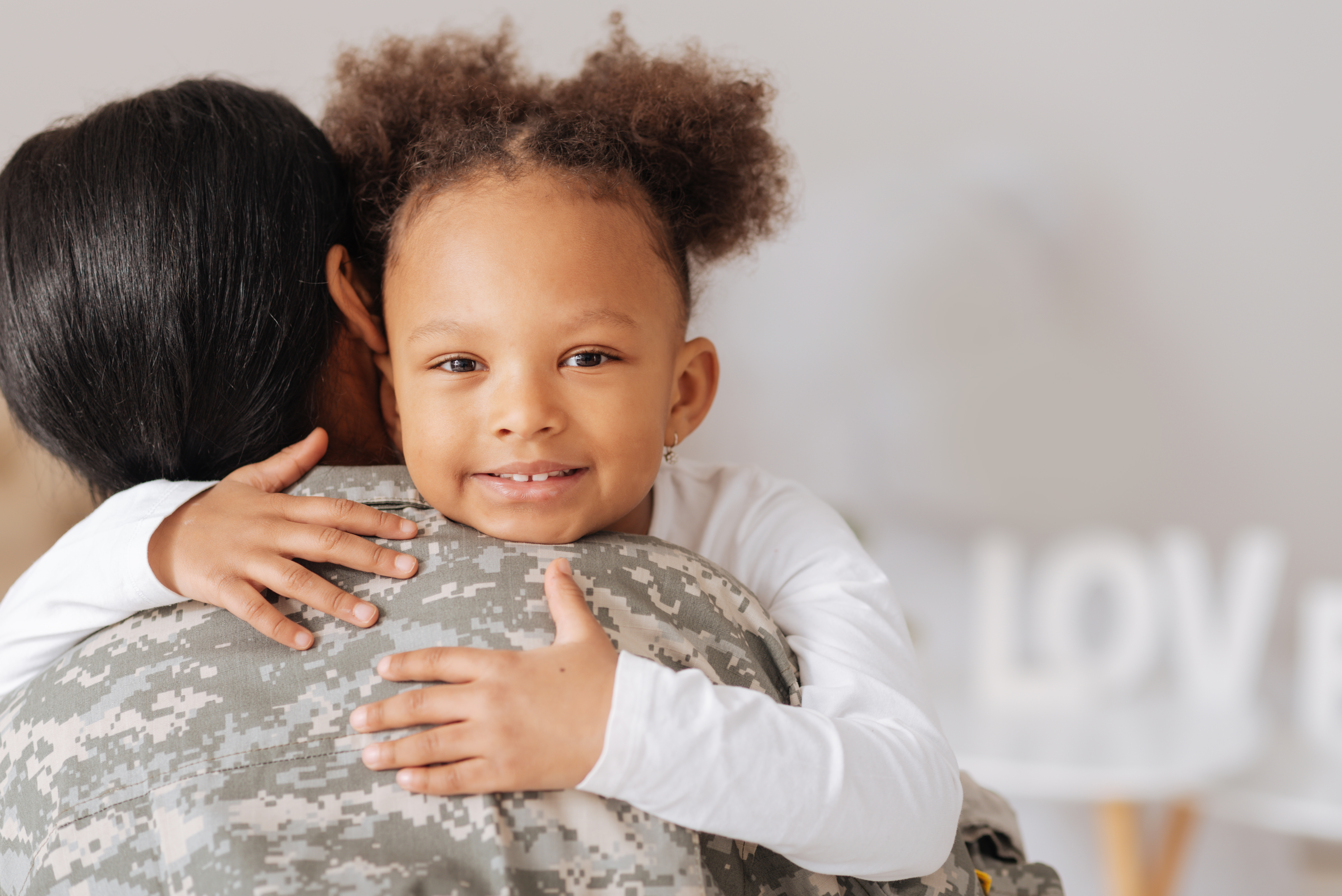 a mother holding her daughter