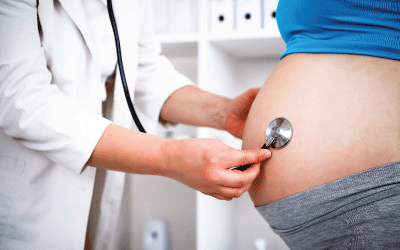 Pregnant woman with doctor