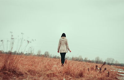 woman alone in field